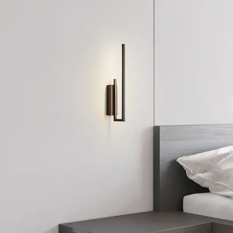 Modern minimalist wall sconce with sleek matte black finish and geometric design perfect as a decorbites brass wall sconce