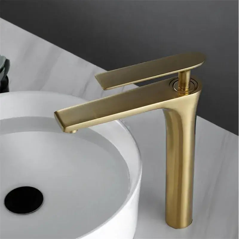 Modern minimalist brushed gold basin faucet with sleek tall cylindrical spout decorbites brushed gold finish