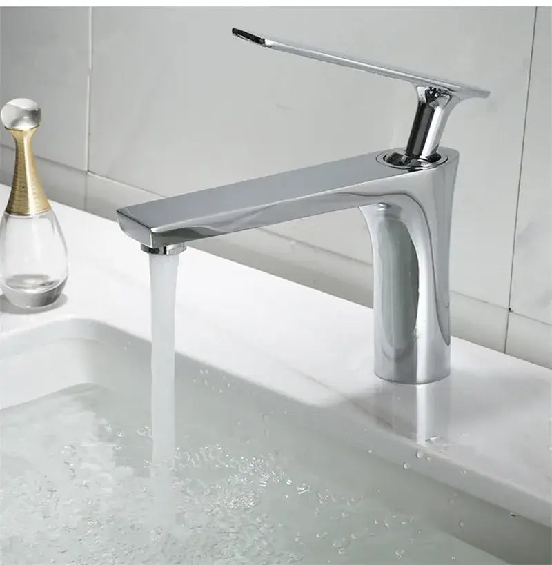 Modern chrome-finished single-handle basin faucet with sleek minimalist design in decorbites brushed gold bathroom style