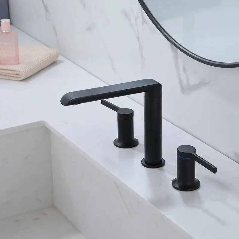 Black matte finish three-handle bathroom faucet with modern design complementing decorbites brushed gold brass fixtures