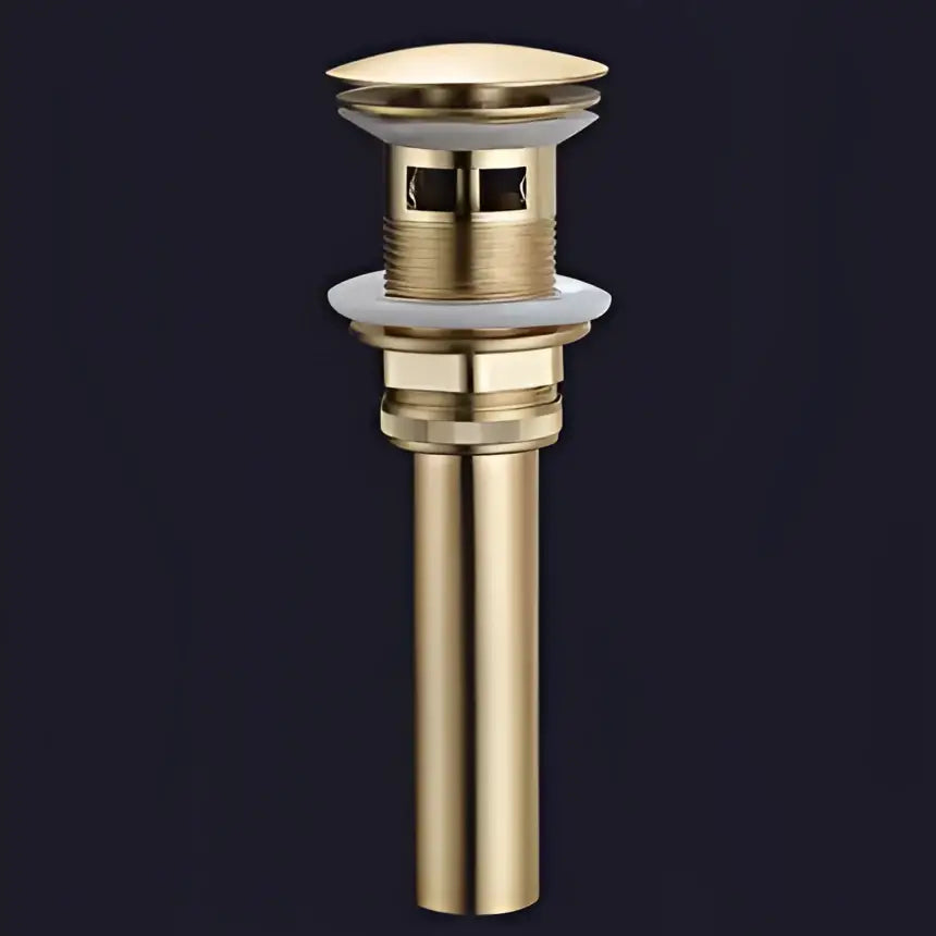 Gold-colored metal drain stopper with textured ridges for decorbites brushed gold brass basin bathroom fixture