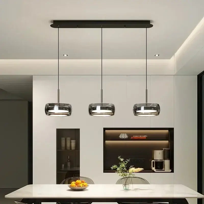 Modern minimalist chrome and glass pendant light with black cylindrical glass shades for decorbites glass dining use