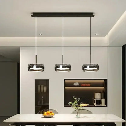 Modern minimalist chrome and glass pendant light with black cylindrical glass shades for decorbites glass dining use