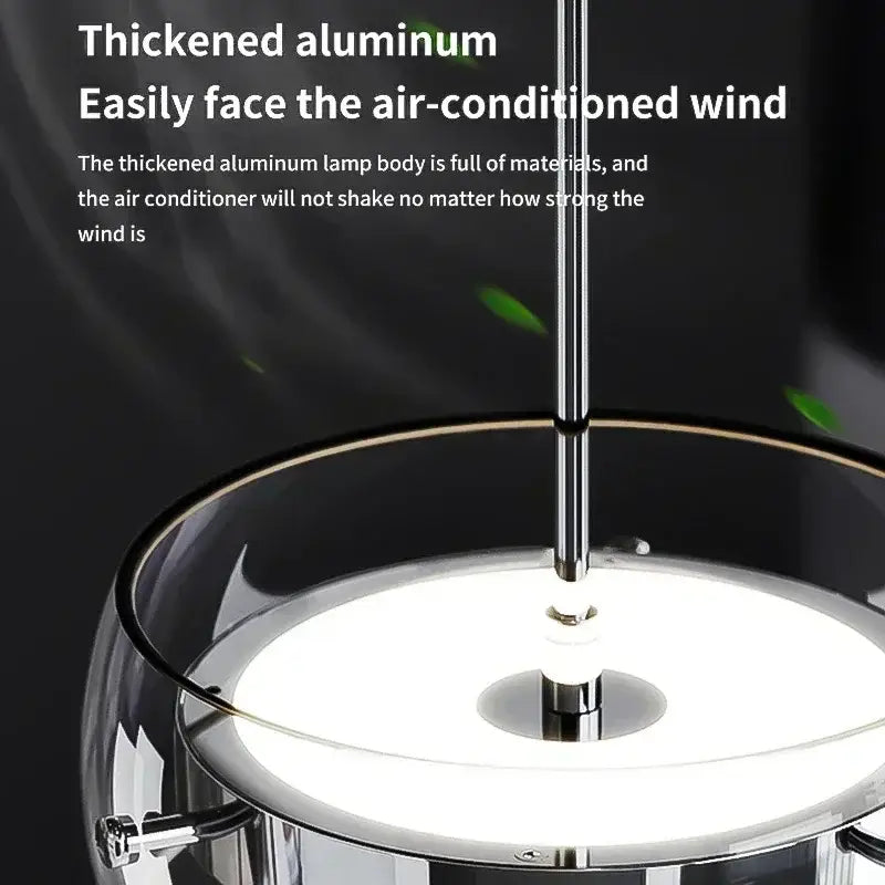 Modern minimalist chrome and glass dining pendant light with a thickened aluminum frame and transparent glass shade