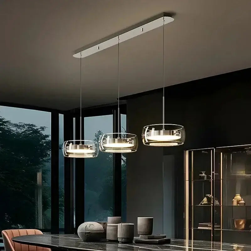 Modern minimalist chrome and glass dining pendant light with transparent shades for decorbites glass dining decor