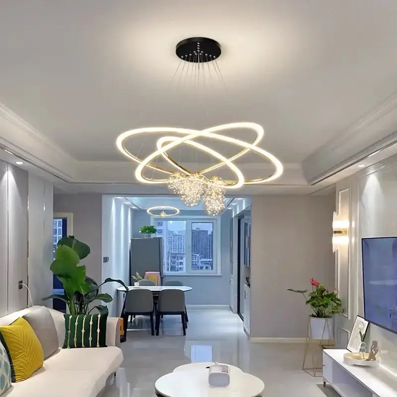 Modern minimalist circle ring pendant light with three glowing interlocking rings and a crystal pendant for bedroom decorbites circle ring