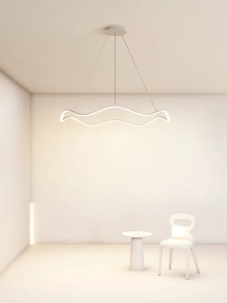 A sleek modern white circle wave led pendant chandelier with minimalist wavy design for dining room decorbites
