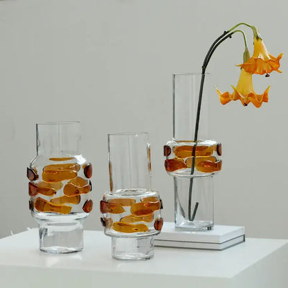 Three clear glass vases with amber embedded pieces and modern minimalist design for decorbites clear glass bubble decor