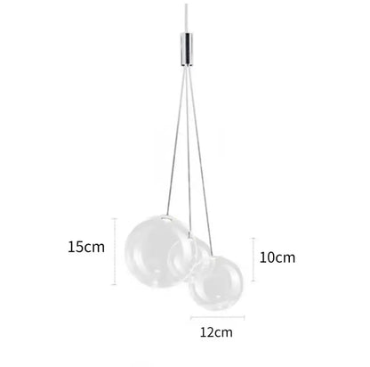 Modern minimalist pendant lamp with two transparent glass ball spheres suspended from a sleek chrome fixture