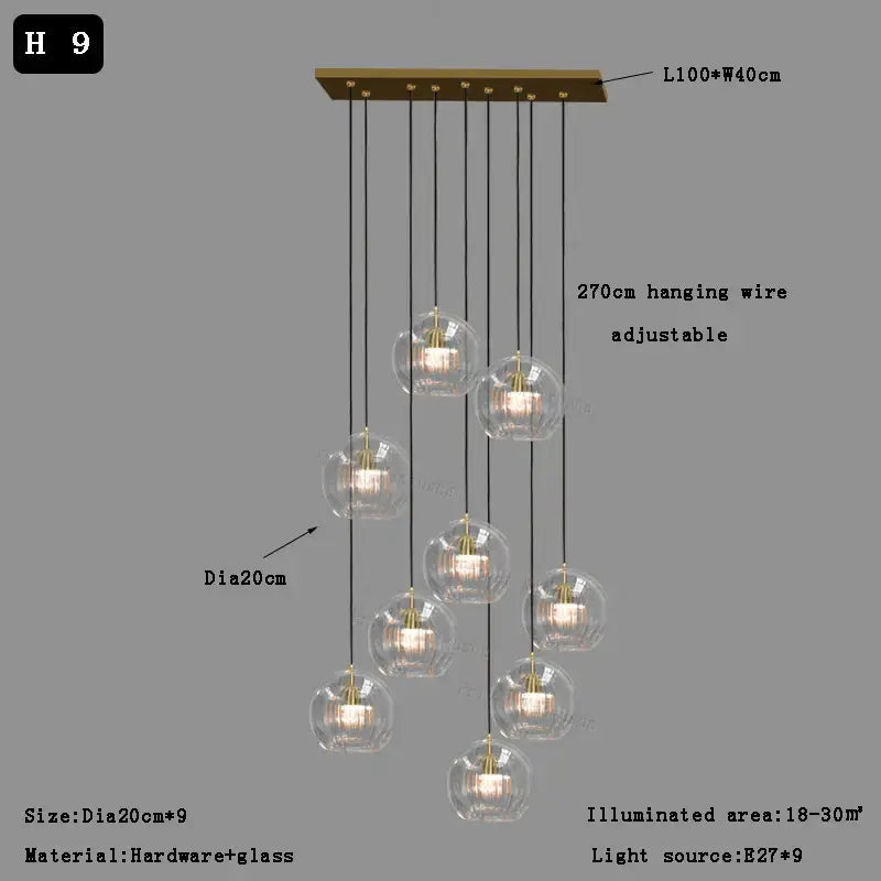 Modern minimalist brass-finished pendant light with nine clear glass ball globes for dining room decorbites clear glass design