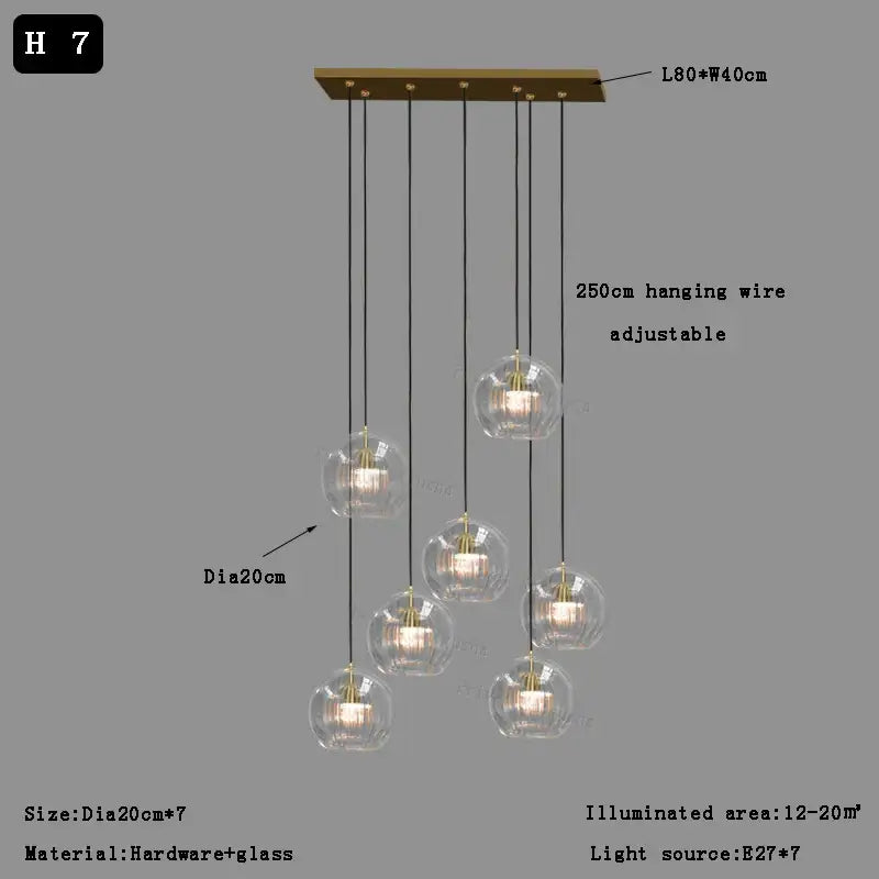 Modern minimalist brass-finished pendant light with seven clear glass ball bulbs for dining room decorbites clear glass