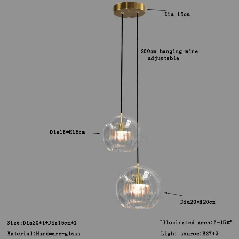 Modern brass-finished pendant light with two clear glass ball globes 15cm and 20cm for dining room decorbites clear glass