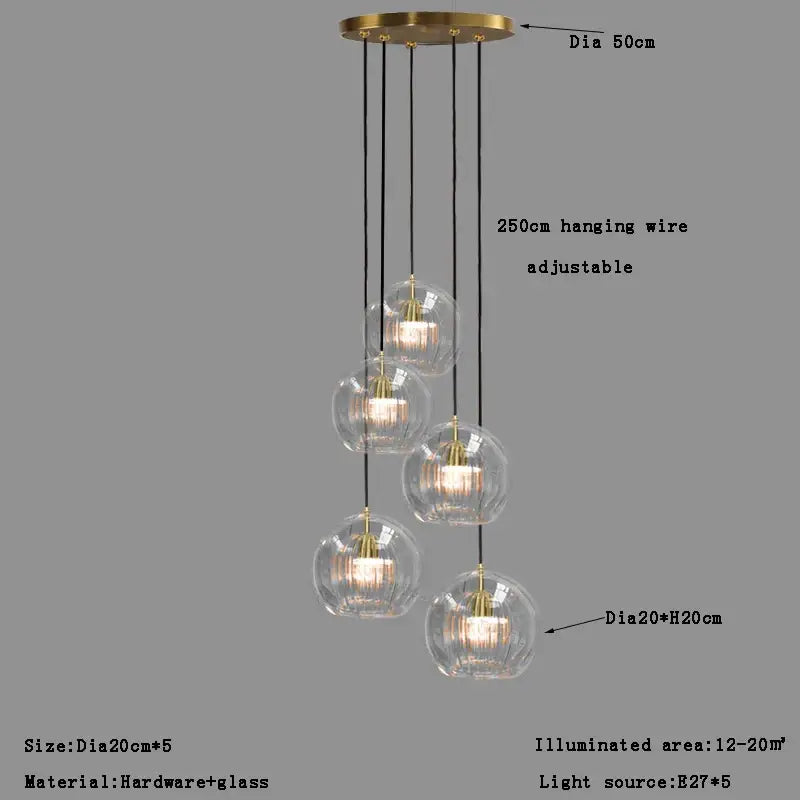 Modern minimalist pendant light with brass finish and five textured clear glass ball shades for dining room decorbites clear glass
