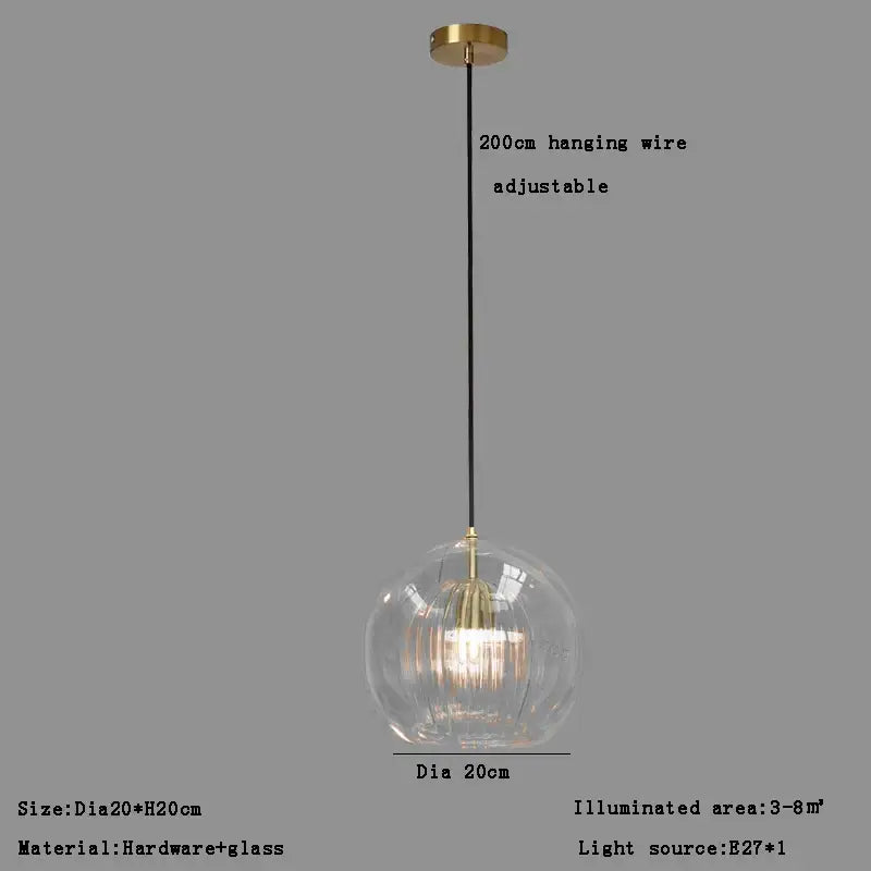 Modern minimalist clear glass ball pendant light with brass fixture and black wire for dining room decorbites pendant light