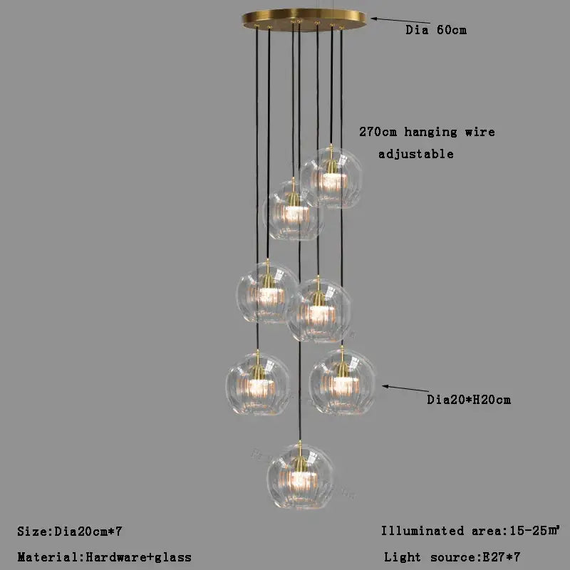 Modern brass-finished pendant light with seven clear glass ball shades for dining room decorbites clear glass design