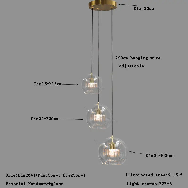 Modern minimalist three-tiered pendant light with clear glass ball globes and brass hardware for dining room decorbites clear glass