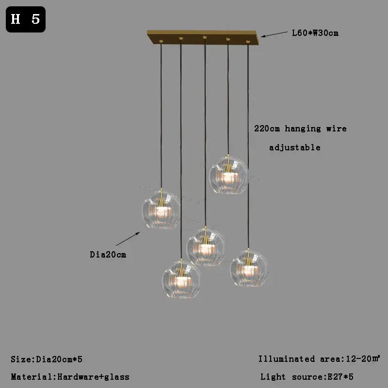 Modern pendant light with five clear glass ball shades and brass-finished hardware for dining room decorbites clear glass design