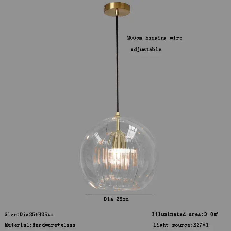 Modern minimalist pendant light with clear glass ball and gold-toned metal fixture for dining room decorbites clear glass