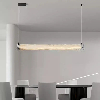Modern minimalist pendant light with translucent textured cloud fog glass and black metal fixtures for dining room