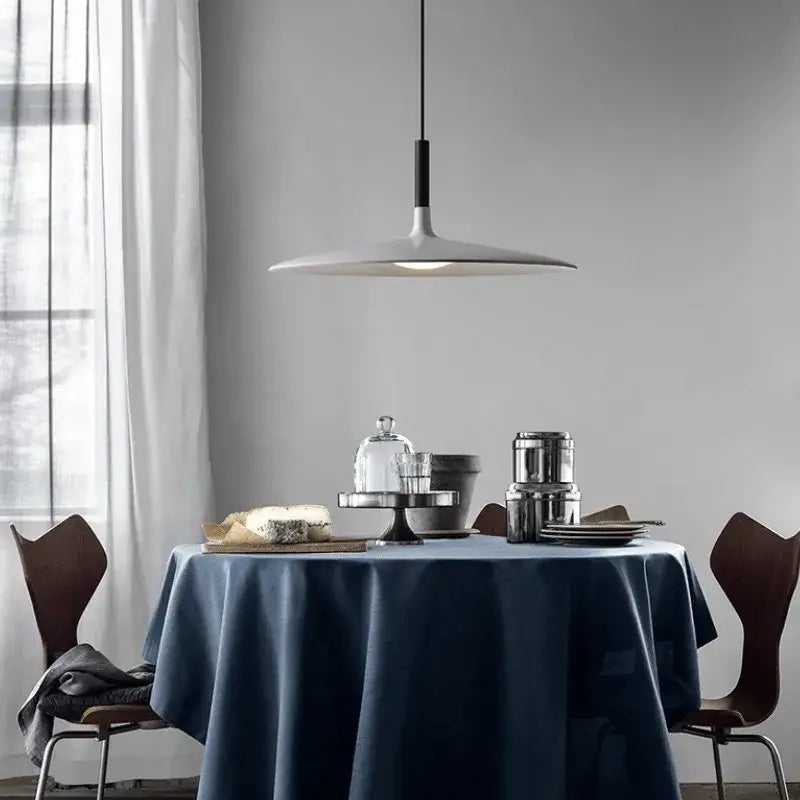 Modern minimalist colorful ufo pendant light with white disc shade and black stem for dining room decorbites pendant lights