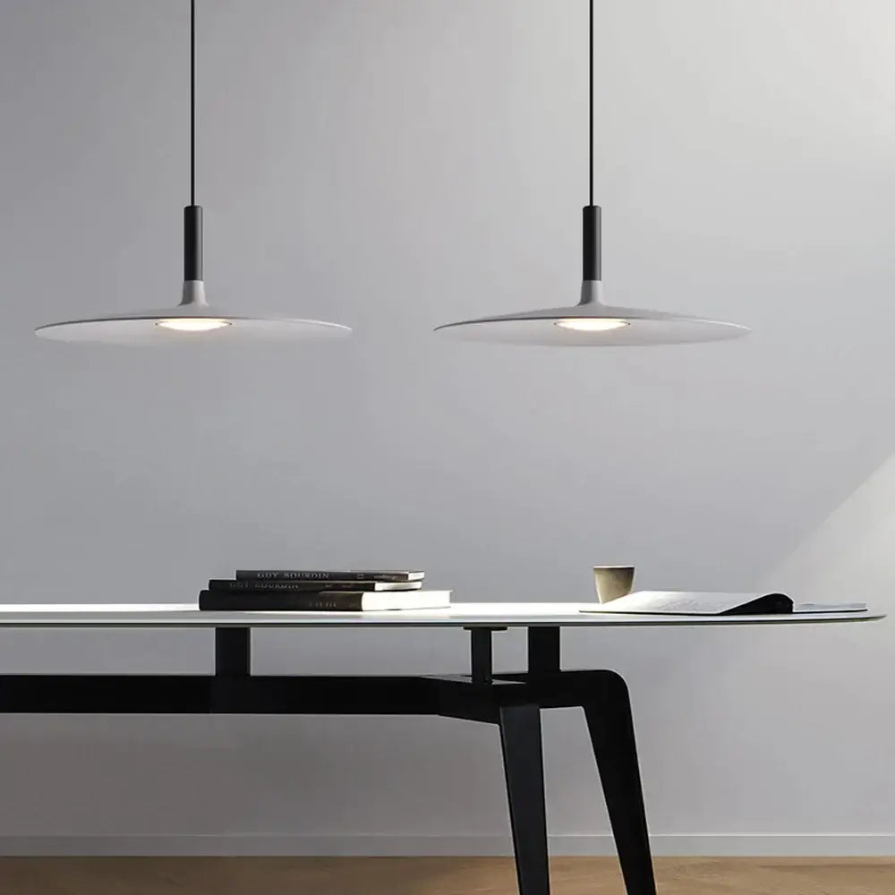 Minimalist white decorbites colorful ufo pendant lights with sleek black cords for modern dining room decor
