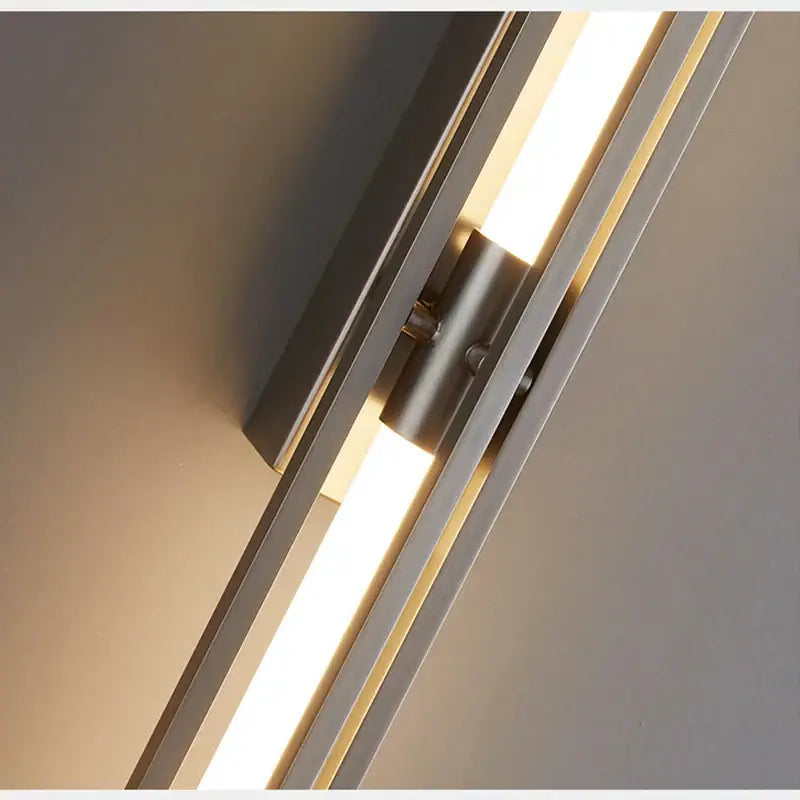 Modern minimalist copper wall lamp with sleek metallic finish and two parallel linear led light strips for bedroom decorbites wall lamp