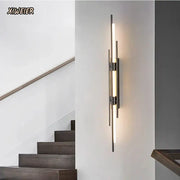Modern minimalist copper wall lamp with slender metallic rods and warm illuminated tube ideal for bedroom decorbites wall lamp