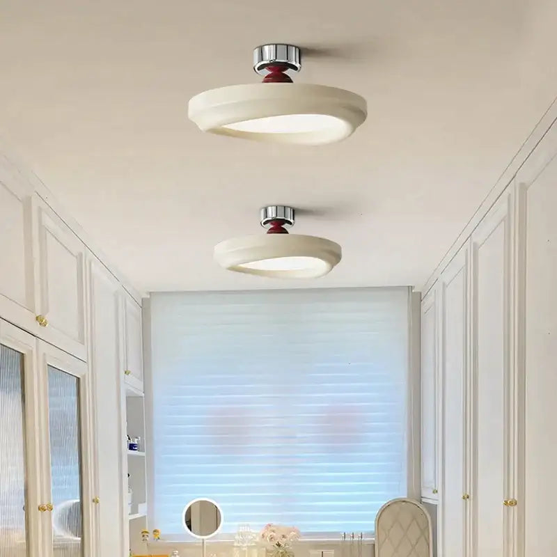 Two modern circular cream led ceiling lights with matte white diffusers and polished chrome fixtures for decorbites cream led decor