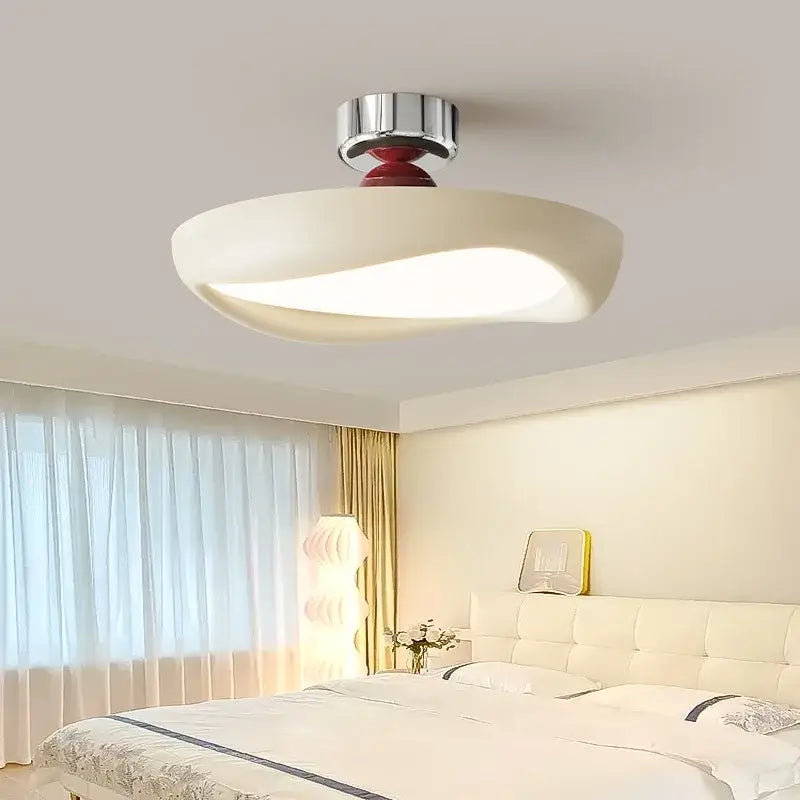 Modern minimalist cream led ceiling light with sleek curved shade and chrome base with red detail for bedroom decorbites cream led ambient decor
