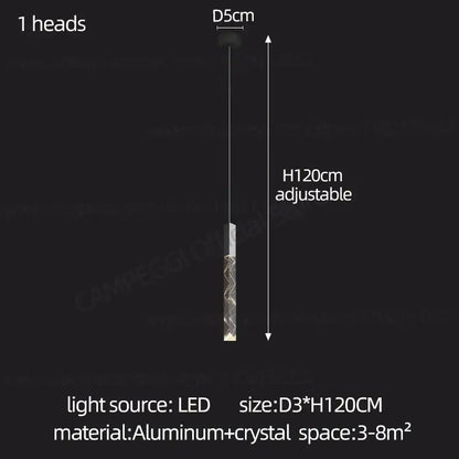 A sleek modern minimalist crystal chrome led chandelier pendant light with cylindrical aluminum and crystal design