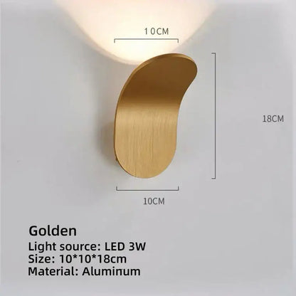 A sleek golden aluminum modern minimalist curved led wall lamp for living room with an integrated led light source