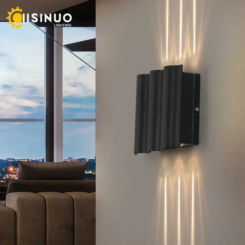 Black cuisinuo sconce light with vertical ridged design casting warm linear light in decorbites 12w black outdoor lamp