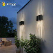 Black cylindrical decorbites 12w black outdoor sconce light with modern minimalist design emitting warm radiant light