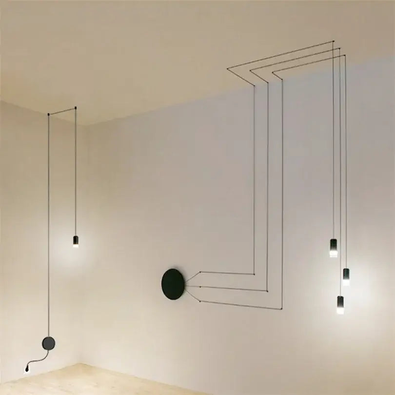 Modern minimalist decorbites black rope pendant lamp with slender cords and cylindrical bulbs in geometric pattern