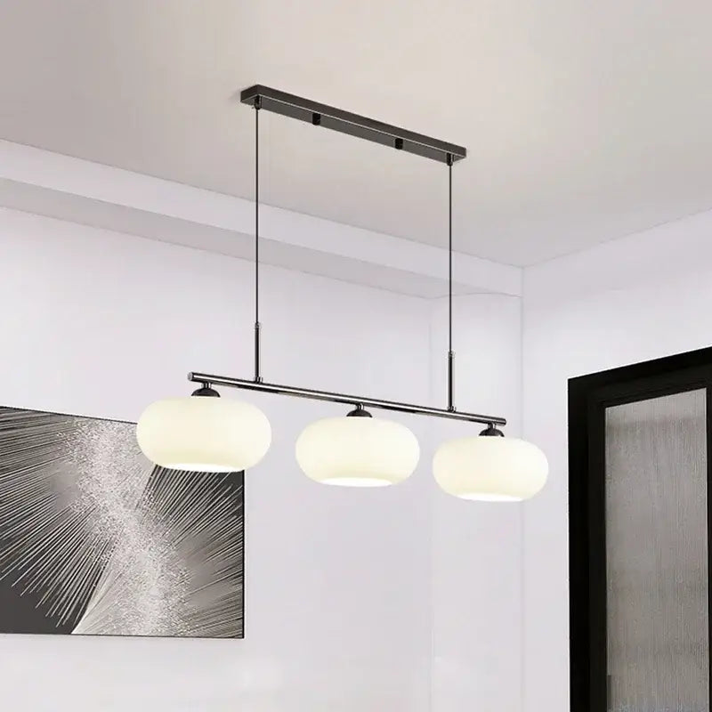 Modern black metal decorbites glass chandelier pendant light with three frosted glass globe shades for living room
