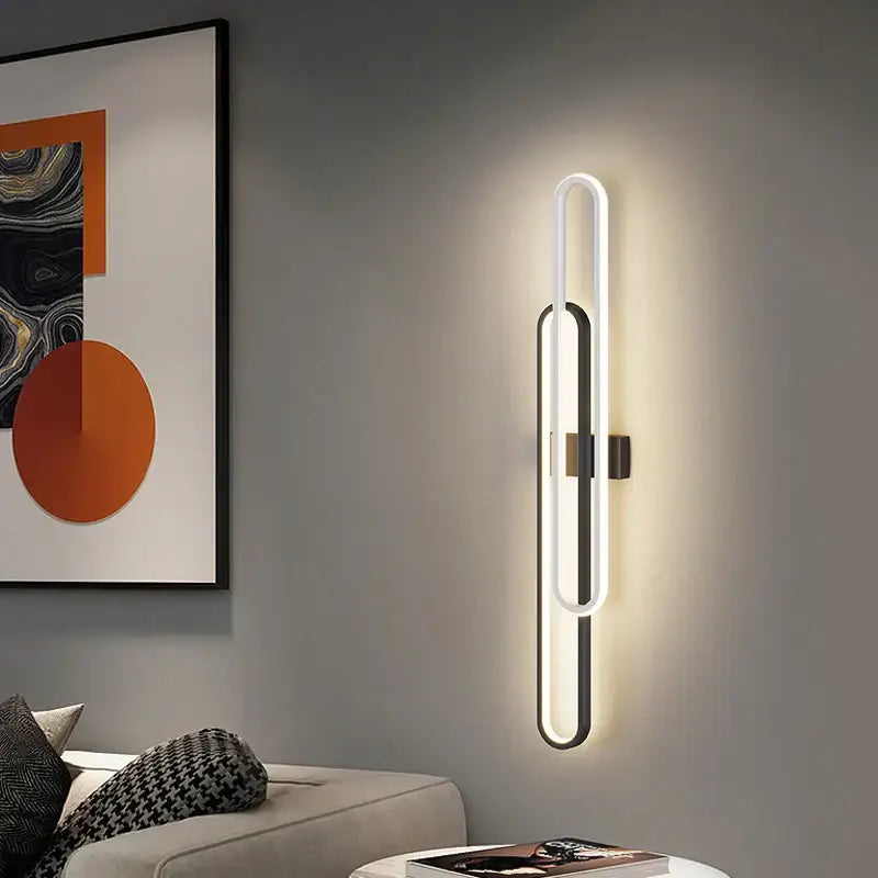 Modern minimalist decorbites led wall sconce with interlocking white and black oval led wall lights for bedroom