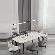 Modern marble dining table with sleek black legs paired with decorbites dimmable led acryl minimalist chandelier