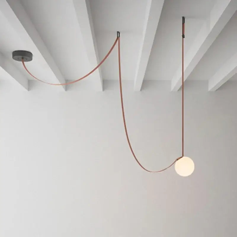 Modern minimalist frosted glass ball pendant light with copper cable and black fixtures for dining room decorbites pendant light