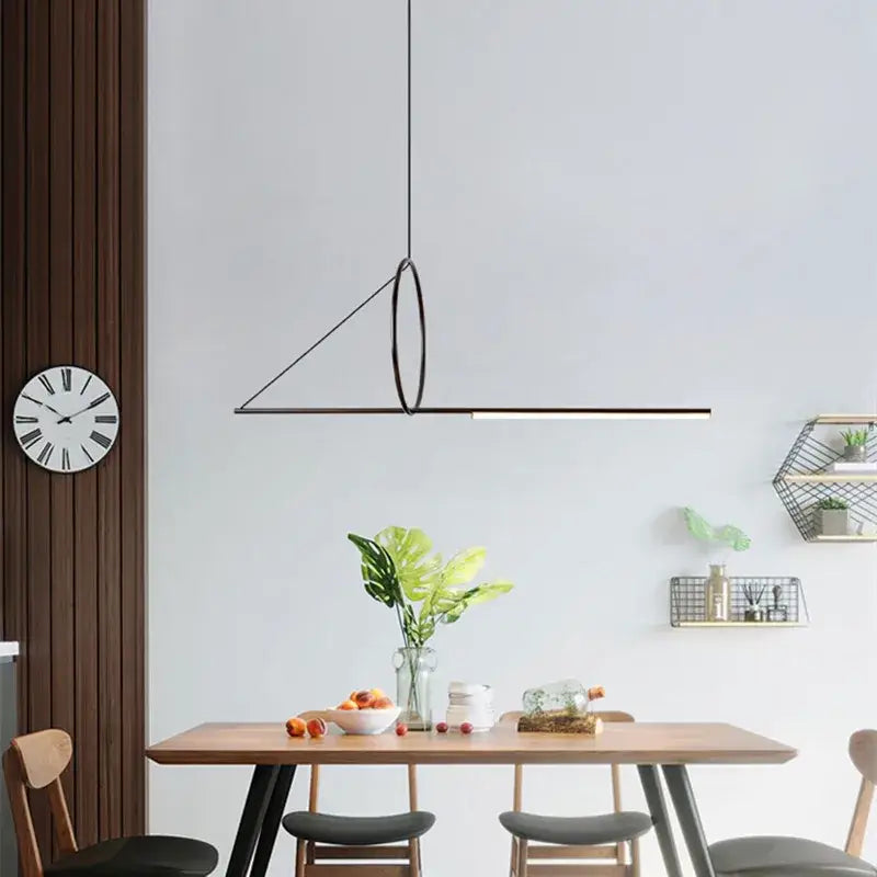 Minimalist black metal pendant light with geometric triangular design and circular accent for modern dining room decorbites geometric chandelier