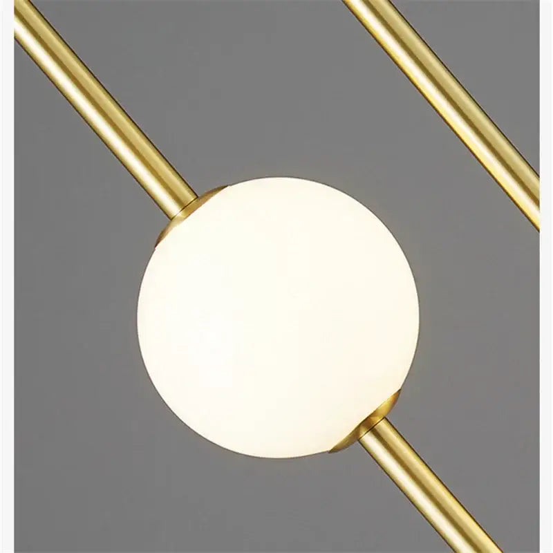 Modern minimalist pendant light with frosted glass ball led globe and brass rods for dining room decorbites glass ball ceiling