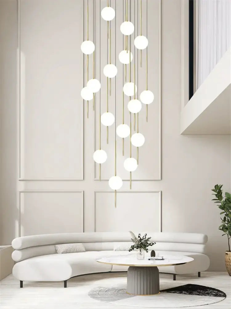Modern minimalist glass ball led ceiling chandelier featuring gold-toned rods and white globes for dining room decorbites glass ball