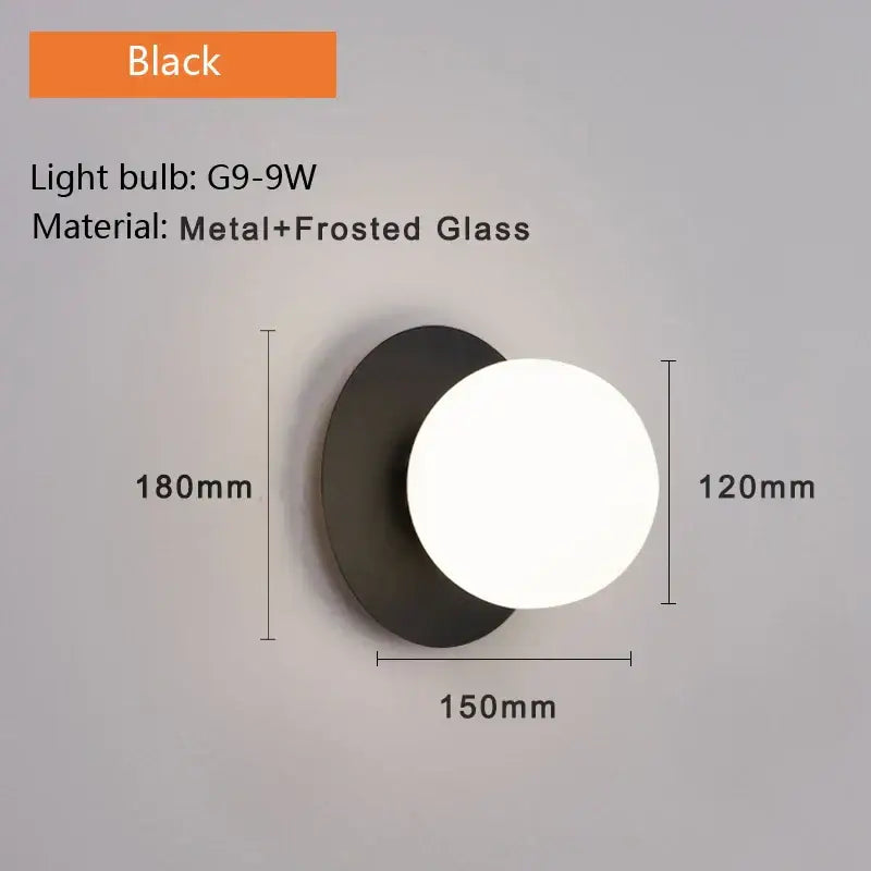 Black minimalist wall lamp with circular frosted glass diffuser and metal base modern led wall lamp for bedroom use