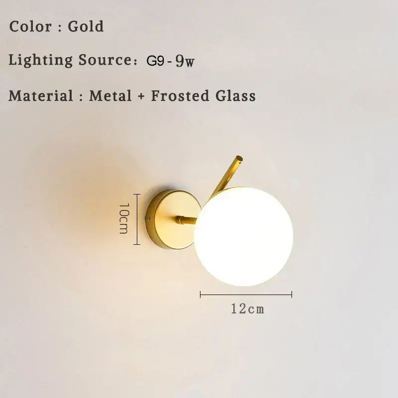 Gold-toned modern minimalist led wall lamp with frosted glass globe and metal bracket for bedroom sconce lighting