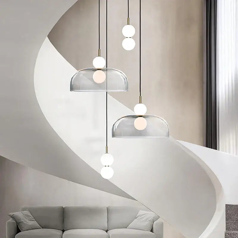 Modern minimalist glass ball pendant light with clear glass domes and white bulbs by decorbites for living room decor
