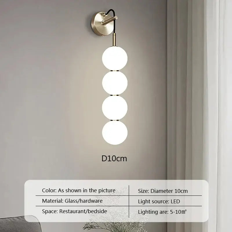 Modern minimalist pendant light with four frosted glass ball spheres and brass hardware for living room decorbites glass ball