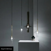 Modern minimalist glass pendant light with sleek metal finishes and flared base for kitchen hanging lamp use