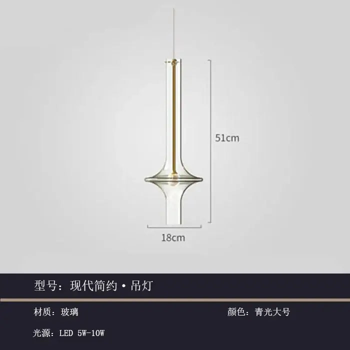 Modern minimalist glass pendant light with clear blue-green tint and gold-toned metal accents for kitchen hanging lamp