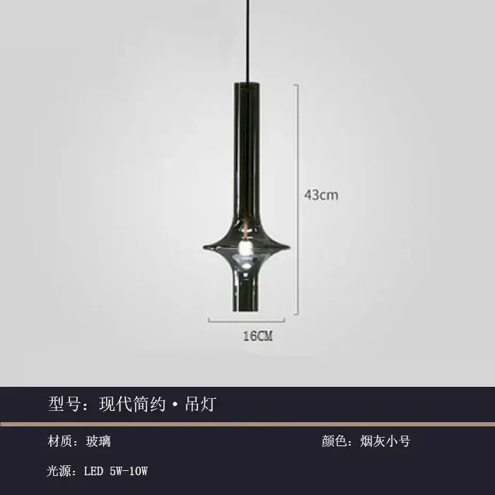 A sleek modern glass pendant light with smoked glass finish and minimalist cylindrical design for kitchen use