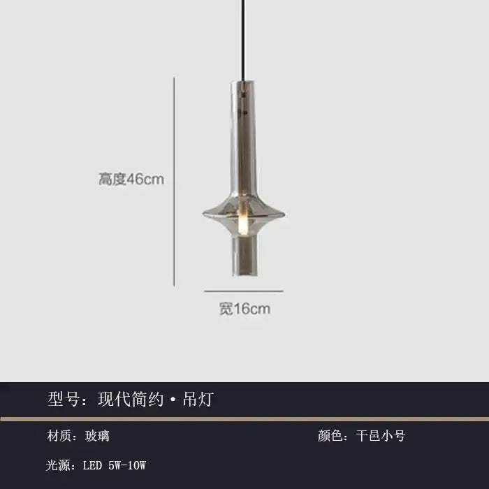 Modern minimalist glass pendant light with sleek cylindrical glass body and brushed metallic finish for kitchen use