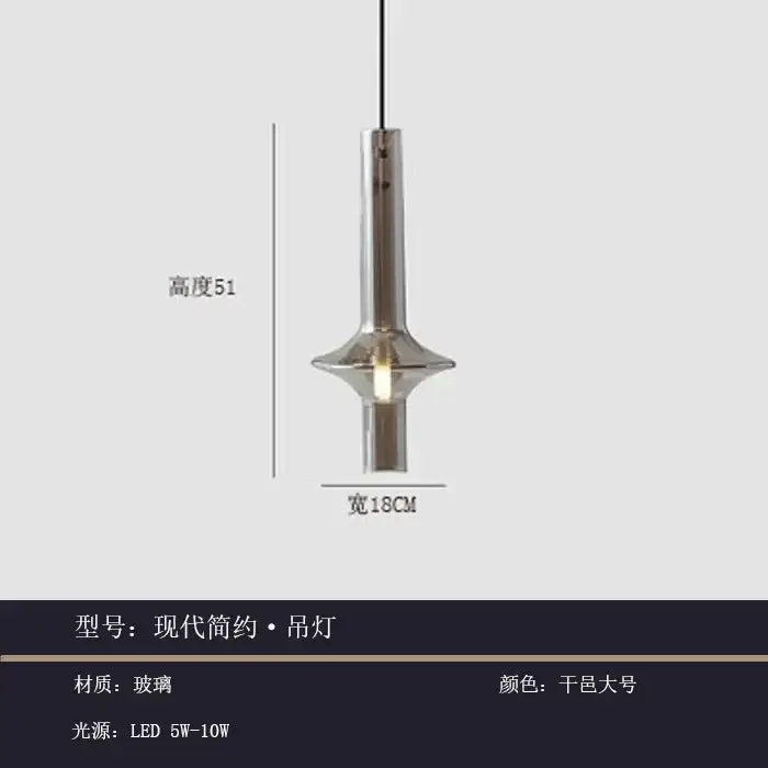 Modern minimalist glass pendant light with a sleek cylindrical glass body and metallic finish for kitchen use